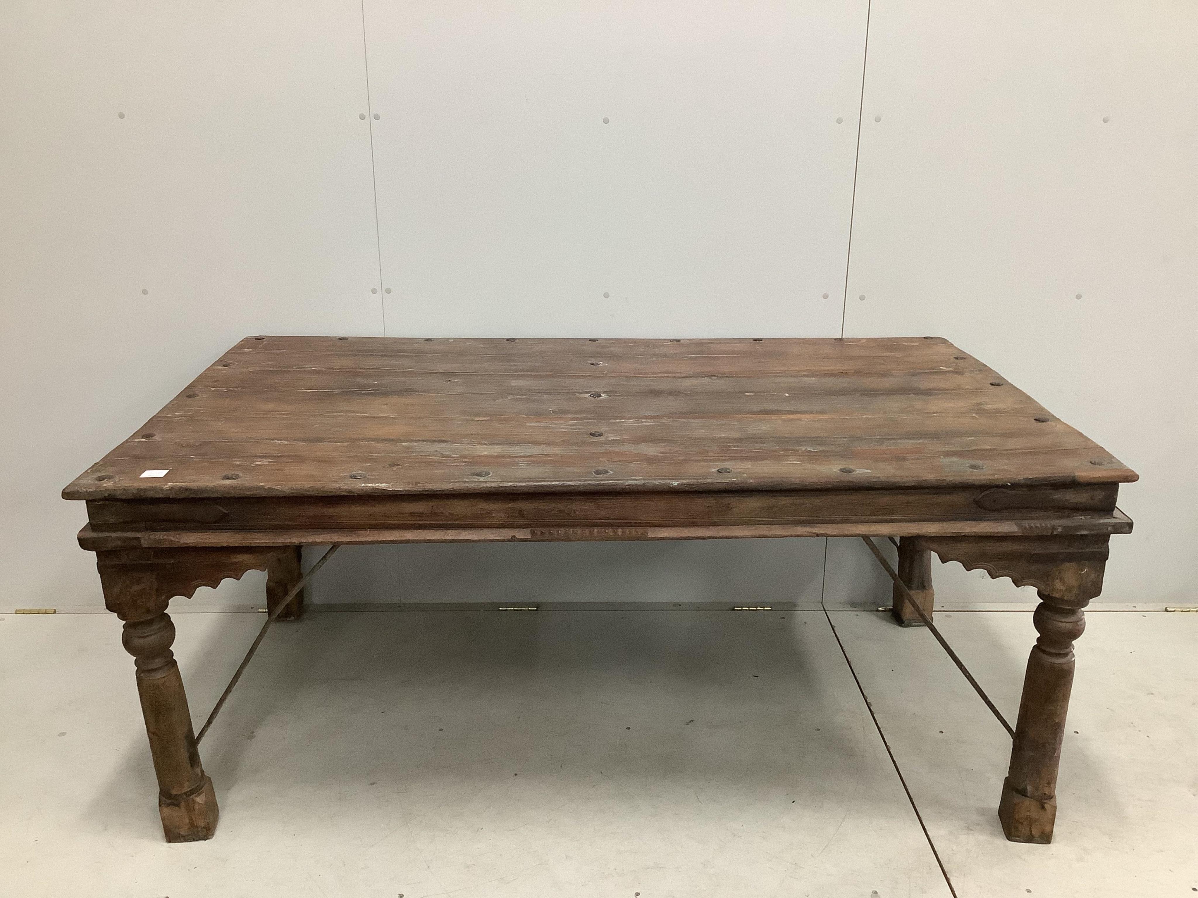 An Indian iron mounted rectangular hardwood table, width 182cm, depth 106cm, height 79cm. Condition - fair